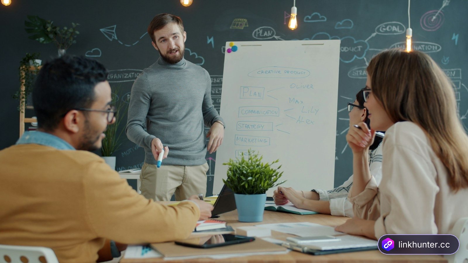 Marketing team planning link building budget and strategy around a whiteboard