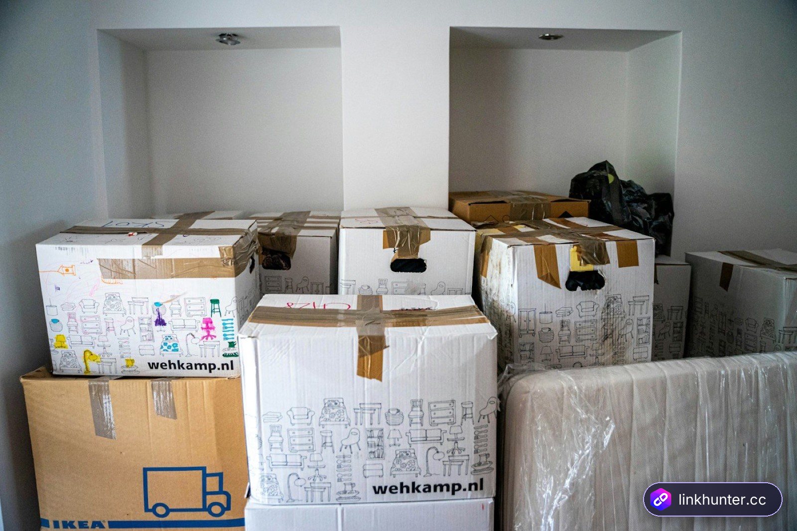 Packed cardboard boxes on a table, representing moving outreach data to a Pitchbox alternative